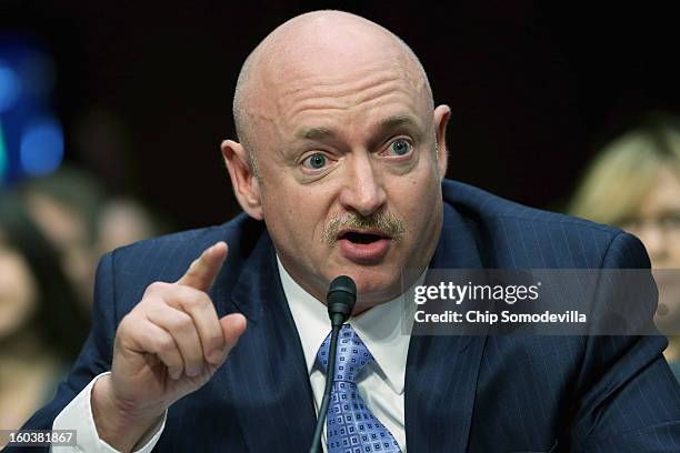 Retired NASA astronaut and Navy Capt. Mark Kelly testifies during a Senate Judiciary Committee hearing about gun control on Capitol Hill January 30,...