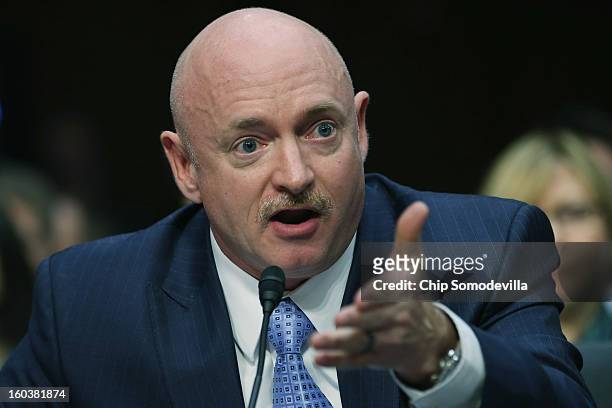 Retired NASA astronaut and Navy Capt. Mark Kelly testifies during a Senate Judiciary Committee hearing about gun control on Capitol Hill January 30,...