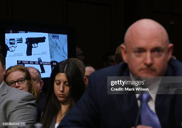 Capt. Mark Kelly, USN Ret. Listens to testimony during a Senate Judiciary Committee hearing on gun violence, January 30, 2013 in Washington, DC. The...