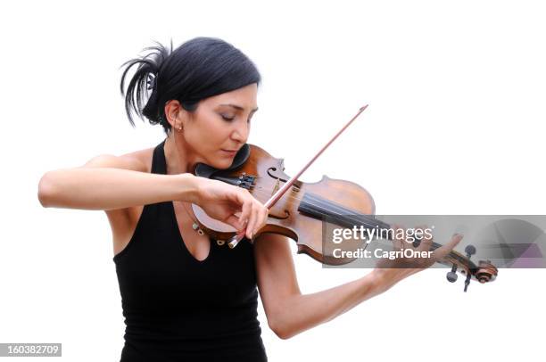 violinist in black tee playing her violin with eyes closed - violinist stock pictures, royalty-free photos & images