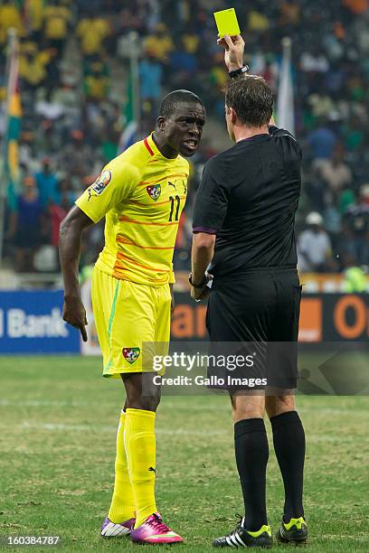 Jonathan Ayite of Togo is shown a yellow card during the 2013 Orange African Cup of Nations match between Togo and Tunisia from Mbombela Stadium on...