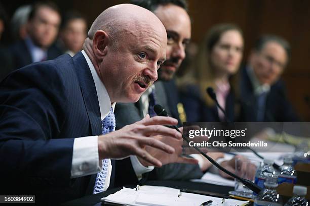 Retired NASA astronaut and Navy Capt. Mark Kelly testifies during a Senate Judiciary Committee hearing about gun control on Capitol Hill January 30,...