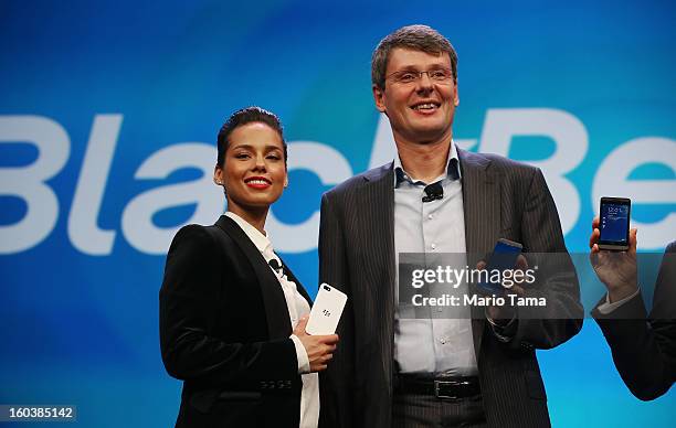 BlackBerry President and Chief Executive Officer Thorsten Heins stands with new BlackBerry Global Creative Director Alicia Keys at the BlackBerry 10...