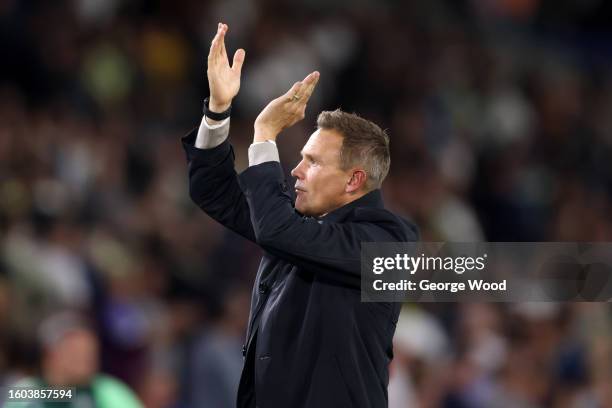 Matthew Taylor, Head Coach of Shrewsbury Town, applauds the fans after the team's defeat in the Carabao Cup First Round match between Leeds United...