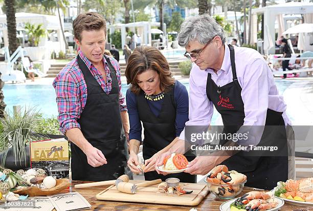 Billy Bush, Catherine 'Kit' Hoover and Steve Sawitz attend Access Hollywood cabana at NAPTE 2013 at Fontainebleau Miami Beach on January 30, 2013 in...