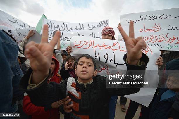 Syrian refugees demonstrate against the Assad regiem inside the Za’atari refugee camp on January 30, 2013 in Mafrq, Jordan. Record numbers of...