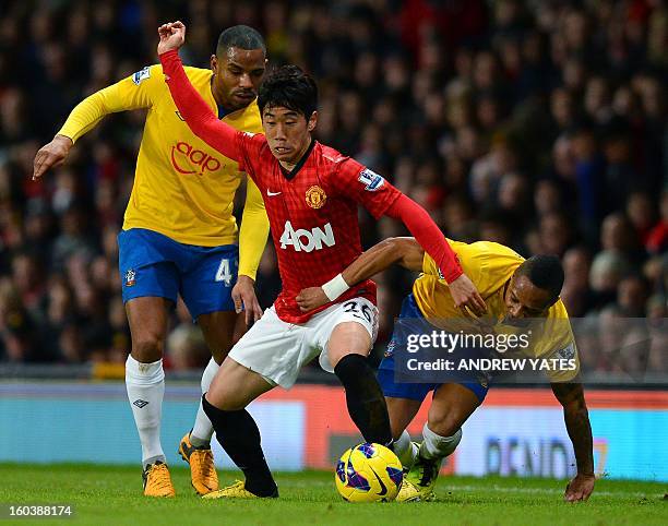 Southampton's English midfielder Jason Puncheon and Southampton's English defender Nathaniel Clyne vie with Manchester United's Japanese midfielder...