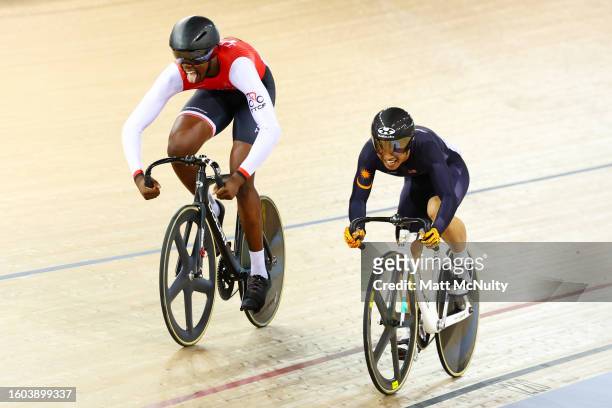 Danell James of Team Trinidad and Tobago celebrates victory against Darwish Putra Muhd Sanusi of Team Malaysia in the Men's Sprint on day five of the...