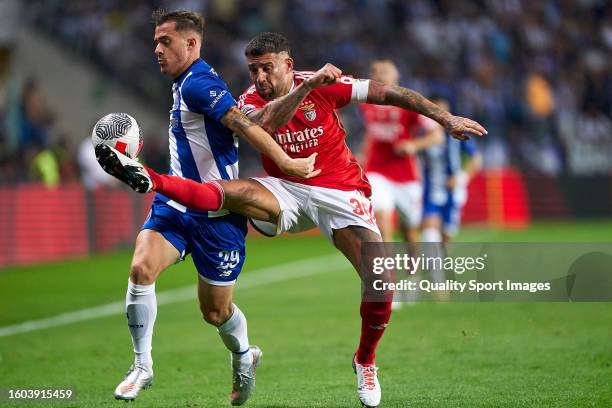 Nicolas Otamendi of SL Benfica competes for the ball with Toni Martinez of FC Porto during the Portuguese SuperCup match between SL Benfica and FC...