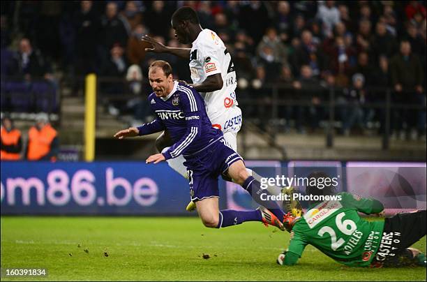 Milan Jovanovic of RSCA is fouled by Kara Mbodjii Serigne of GENK in action during the Cofidis Cup match between RSC Anderlecht and KRC Genk on...