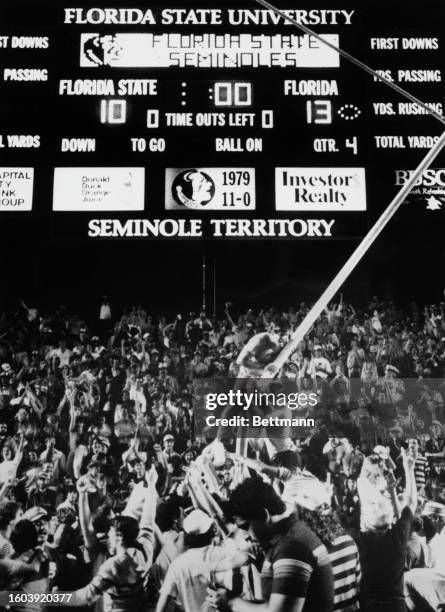 Fans of the Florida Gator team cheer victorious after their team beat Florida State Seminoles, at Doak S. Campbell Stadium, Tallahassee, Florida,...