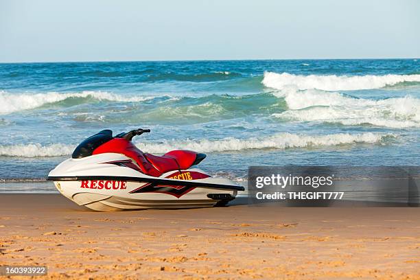 rescue wetbike on the beach - surf rescue stock pictures, royalty-free photos & images