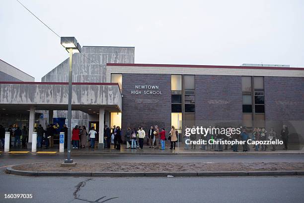 Members of the Sandy Hook community gather at Newtown High School as Connecticut state politicians and members of the community gather for...