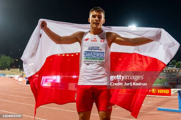 Marek Zakrzewski of Poland poses with flag after Men's 200m during European Athletics U20 Championships Jerusalem - Day Three on August 09, 2023 in...