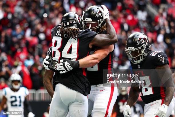 Cordarrelle Patterson of the Atlanta Falcons hugs Kaleb McGary during an NFL game against the Carolina Panthers at Mercedes-Benz Stadium on October...