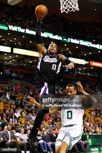 Thomas Robinson of the Sacramento Kings dunks over Avery Bradley of the Boston Celtics during the game on January 30, 2013 at TD Garden in Boston,...