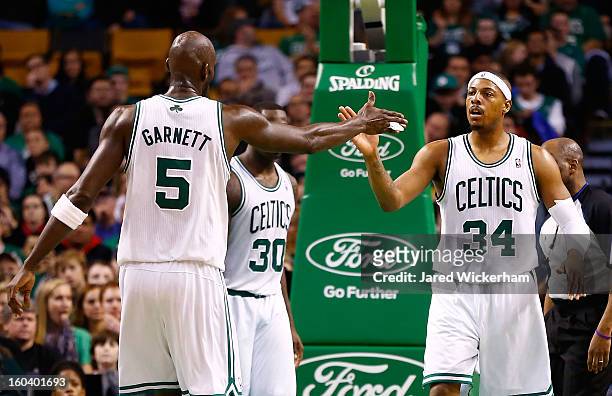 Kevin Garnett of the Boston Celtics congratulates teammate Paul Pierce of the Boston Celtics during the game against the Sacramento Kings on January...