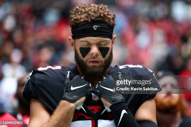 Erik Harris of the Atlanta Falcons stands during the national anthem prior to an NFL game against the Carolina Panthers at Mercedes-Benz Stadium on...