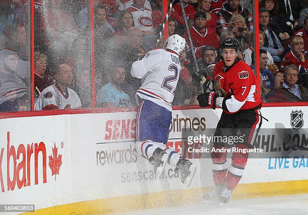 Kyle Turris of the Ottawa Senators sidesteps an attempted body check by Brian Gionta of the Montreal Canadiens on January 30, 2013 at Scotiabank...