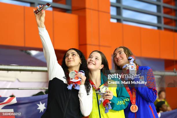 Gold medalist Hannah Erin Allen of Australia, Silver medalist Hanna Abdou of New Zealand and Bronze medalist Harper Barrowman of Cayman Islands pose...