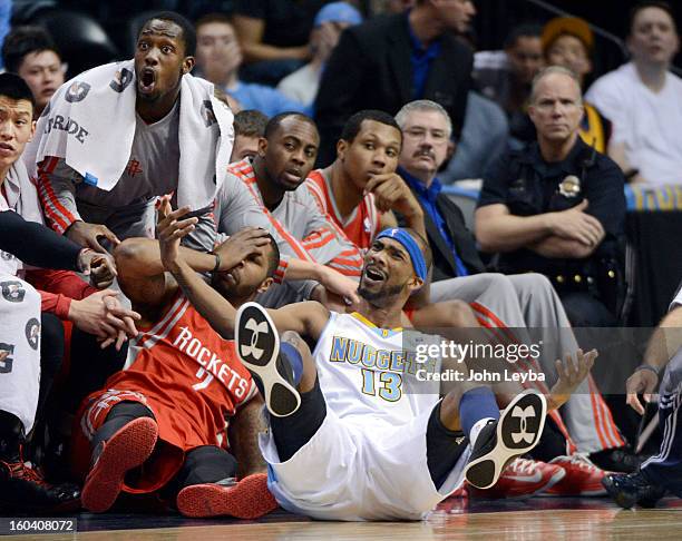 Denver Nuggets small forward Corey Brewer looks to the referee for the foul after Houston Rockets power forward Marcus Morris ran in to him...