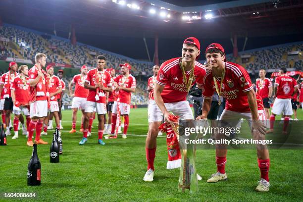 Antonio Silva and Joao Neves of SL Benfica pose with the trophy of Portuguese SuperCup after the Portuguese SuperCup match between SL Benfica and FC...