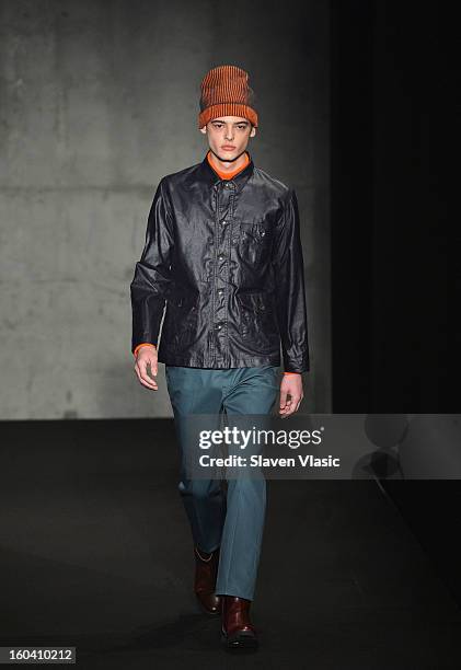 Model walks the runway during the Rag & Bone Men's collection fall 2013 fashion show on January 30, 2013 in New York City.