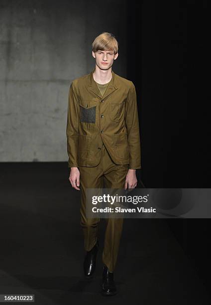 Model walks the runway during the Rag & Bone Men's collection fall 2013 fashion show on January 30, 2013 in New York City.