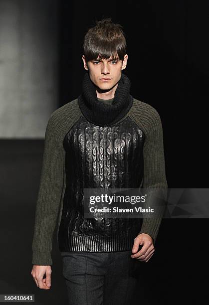 Model walks the runway during the Rag & Bone Men's collection fall 2013 fashion show on January 30, 2013 in New York City.