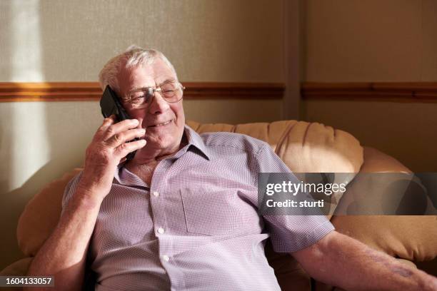 senior man keeping connected - communication occupation stock pictures, royalty-free photos & images