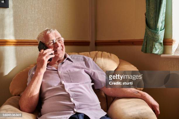 senior man keeping connected - communication occupation stock pictures, royalty-free photos & images