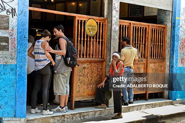 By Francisco Jara Tourists visit the famous Bodeguita del Medio bar in the Cuban capital, Havana, on April 23, 2012. April 26 will mark the 70th...