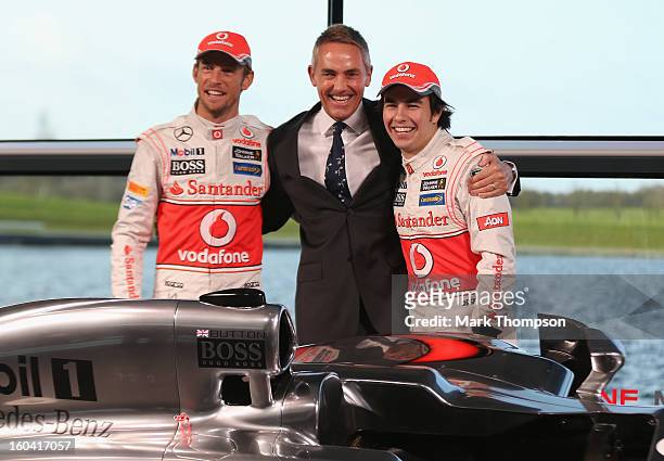 McLaren Mercedes Formula 1 drivers Jenson Button of Great Britain and Sergio Perez of Mexico with team principal Martin Whitmarsh at the unveiling of...