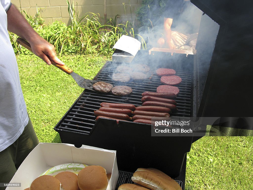 Grilling hot dogs and hamburgers ouside