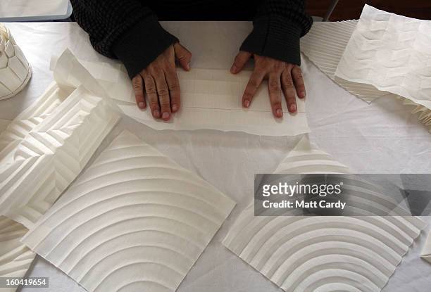 Artist Joan Sallas works on some folded linen for his new exhibition 'Folded Beauty: Masterpieces in Linen', which is opening at the Holbourne Museum...