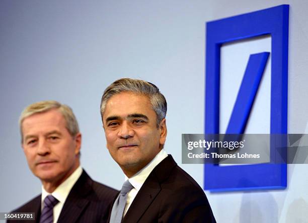 Juergen Fitschen , co-CEO of Deutsche Bank AG, and Anshu Jain, co-CEO of Deutsche Bank AG, pose for the photographers after the company's annual...