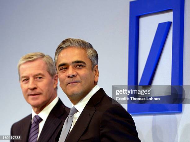 Juergen Fitschen , co-CEO of Deutsche Bank AG, and Anshu Jain, co-CEO of Deutsche Bank AG, pose for the photographers after the company's annual...