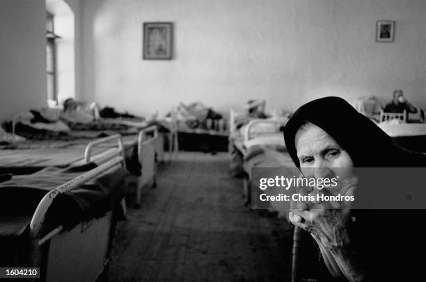 Draga Mojsich sits quietly in a sleeping room July 15, 1999 of Bagoslavia, a Serbian Orthodox seminary in Prizren, Kosovo where approximately 150...
