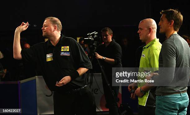 Raymond van Barneveld of Netherlands in action during a dart show tournament at between team Netherlands and Hamburger SV at Imtech Arena on January...