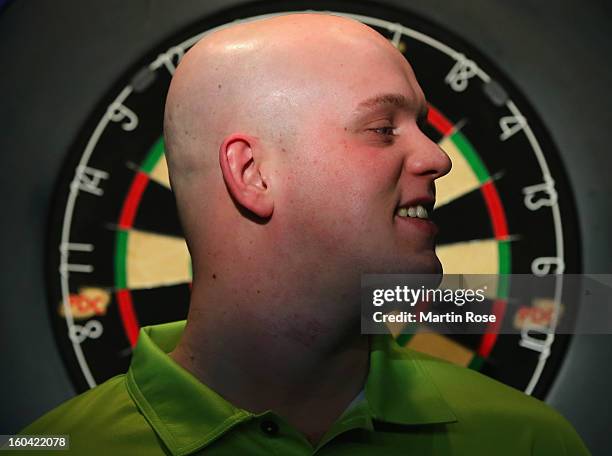 Michael van Gerwen of Netherlands looks on during a dart show tournament at between team Netherlands and Hamburger SV at Imtech Arena on January 31,...