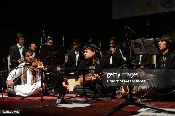 Young Afghan musician perform during a stage performance at French Culture Center in Kabul on January 31, 2013. Afghanistan's youth orchestra flies...