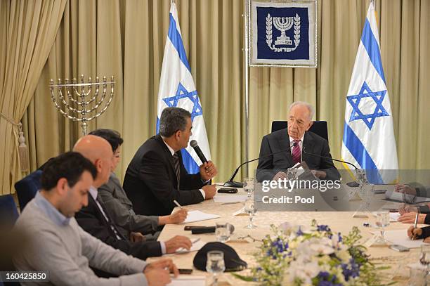 Israeli President Shimon Peres meets with representatives of Balad to discuss forming a new Israeli government on January 31, 2013 in Jerusalem,...