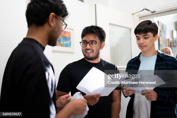 Habib Matlib, Umair Abdullah and John Bose receive their A Level results at Ffynone House School on August 17, 2023 in Swansea, Wales. Due to a...