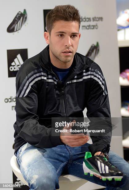 Barcelona football player Jordi Alba presents the latest Adidas F50 shoe at the Adidas Mataro Park Commercial store on January 31, 2013 in Mataro,...