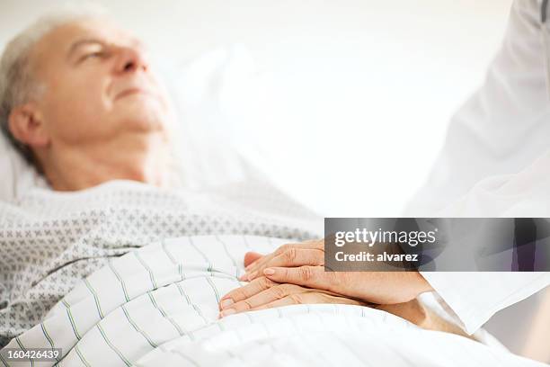 senior patient taken care of a doctor - hhp5 stock pictures, royalty-free photos & images