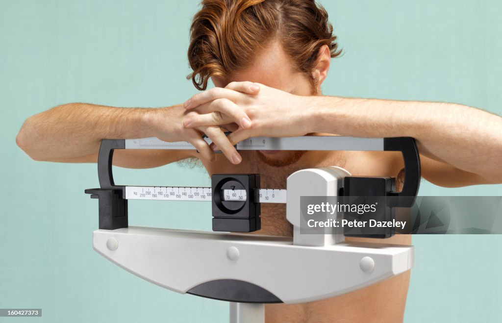 Distraught man with eating disorder