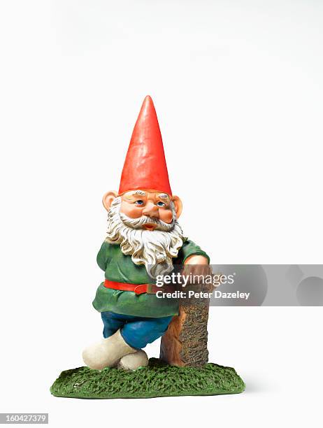 garden gnome relaxing with copy space - garden gnome stock pictures, royalty-free photos & images