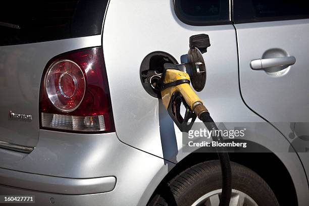 Vehicle has its tank filled at a Petroleo Brasileiro SA station in Rio de Janeiro, Brazil, on Thursday, Jan. 31, 2013. State-controlled oil company...