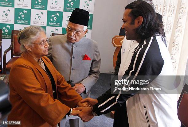 Delhi Chief Minister Sheila Dikshit shares a laugh with tennis player Leander Paes during the draw for Davis Cup Asia/Oceania Group I at Delhi Lawn...