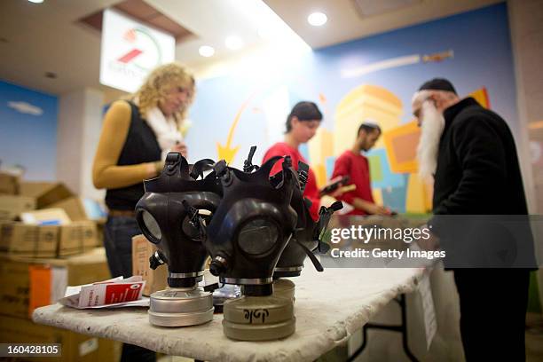 Gas maskes sit on a table at a gas mask kit distribution station January 31 in Pisgat Ze'ev, East Jerusalem, Israel. Israel remains on high alert...